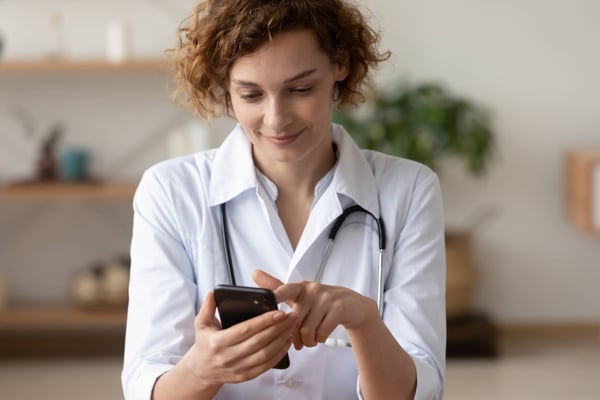 female holding phone
