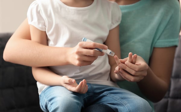 Woman and child with diabetes